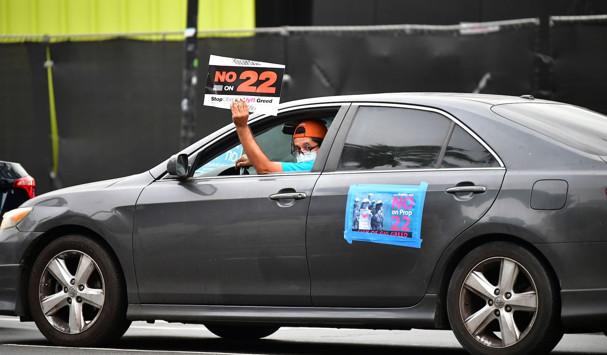 App-based drivers from Uber and Lyft protest in a caravan in front of City Hall in Los Angeles on October 22, 2020.