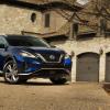 2021 Nissan Murano parked in front of an affluent home
