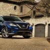 2021 Nissan Murano parked in front of an affluent home
