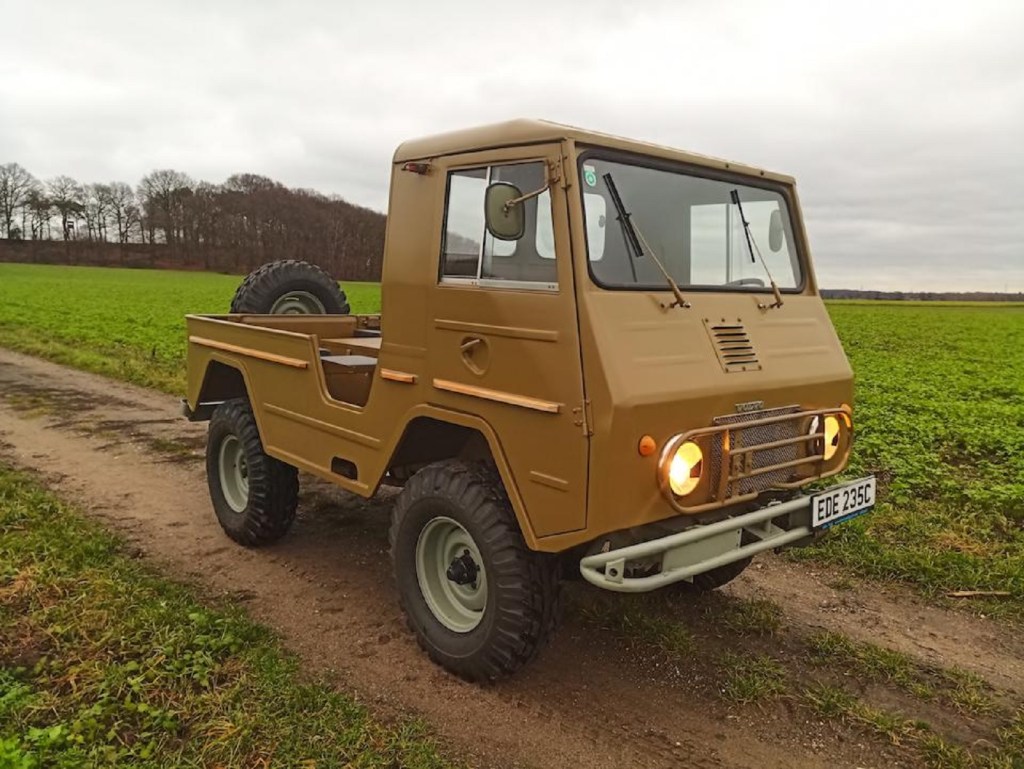 A brown 1965 Volvo L3314 Laplander truck in a field