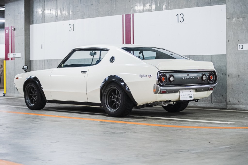 The rear 3/4 view of a white 1973 'Kenmeri' KPGC110 Nissan Skyline GT-R