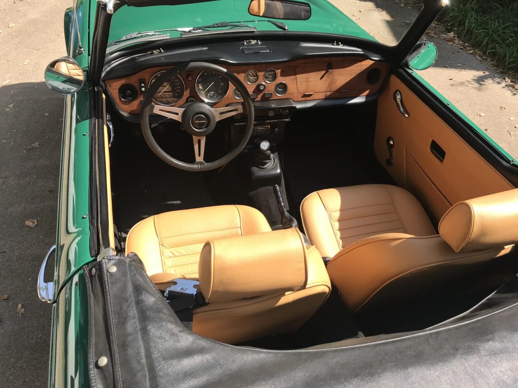 The tan-leather interior of a 1974 Triumph TR6
