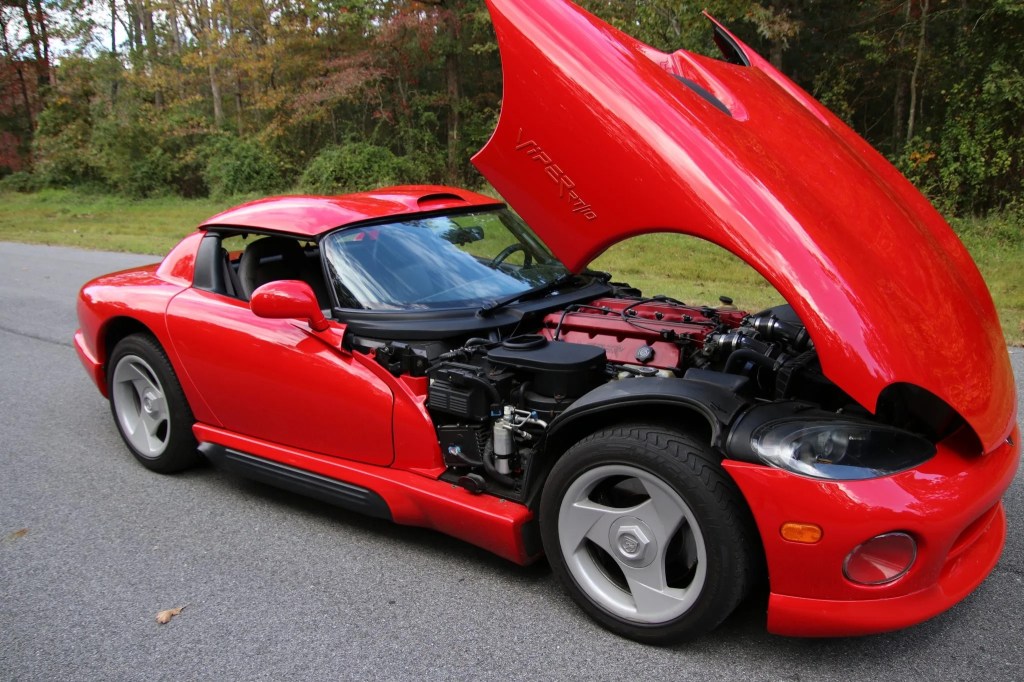 A red 1994 Dodge Viper RT/10 with its hood open