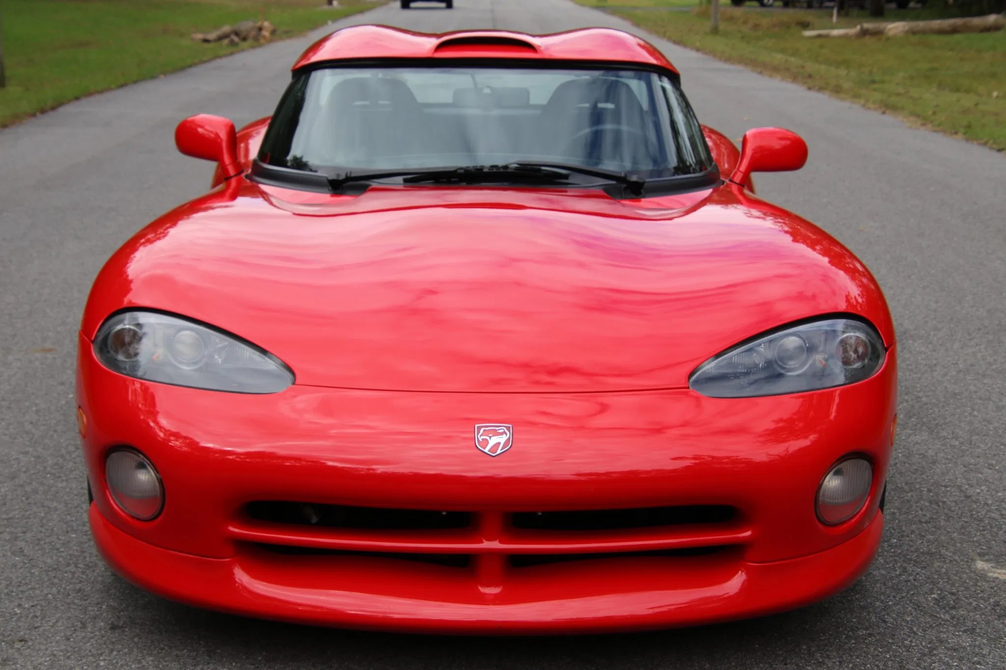 The front view of a red 1994 Dodge Viper RT/10 with a hardtop