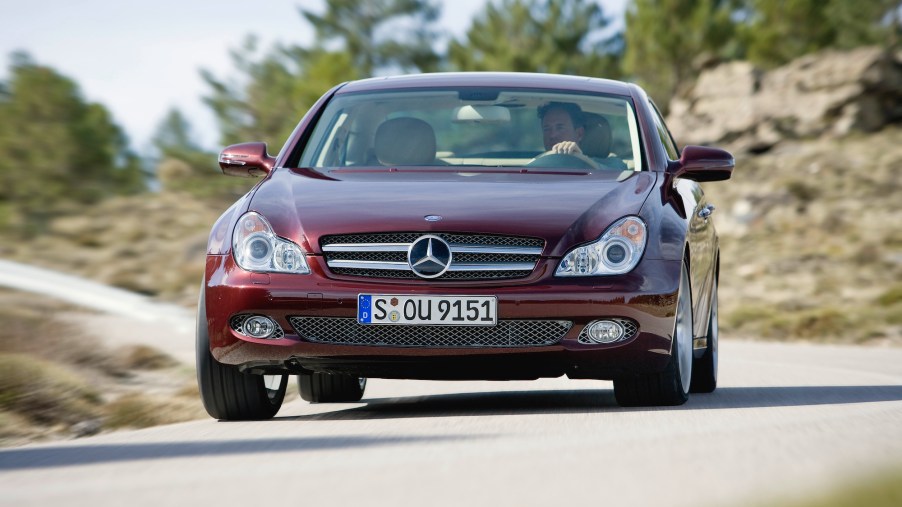 A burgundy 2008 Mercedes-Benz CLS-Class, CLS 280 navigates a mountainous road