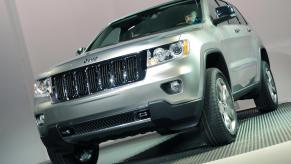 A silver 2011 Jeep Grand Cherokee is unveiled at the New York International Auto Show April 8, 2009, in New York.