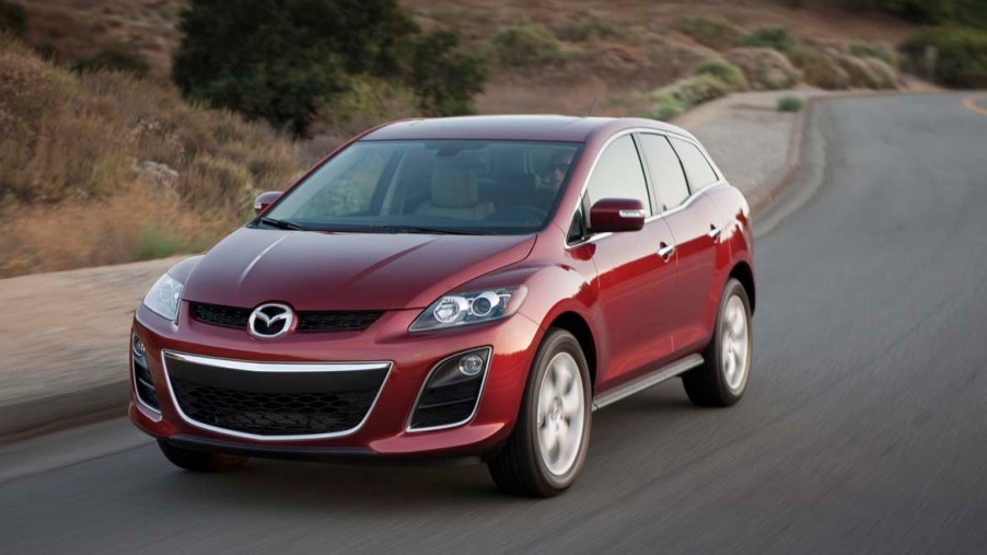 A red Mazda CX-7 on the track.