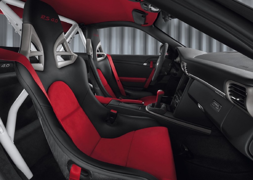 The 2012 Porsche 911 GT3 RS 4.0's red-and-black seats, white roll cage, and black dash