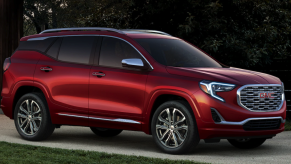 A red 2019 GMC Terrain Denali parked in the driveway.