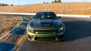 A green 2020 Dodge Charger sits on a racetrack