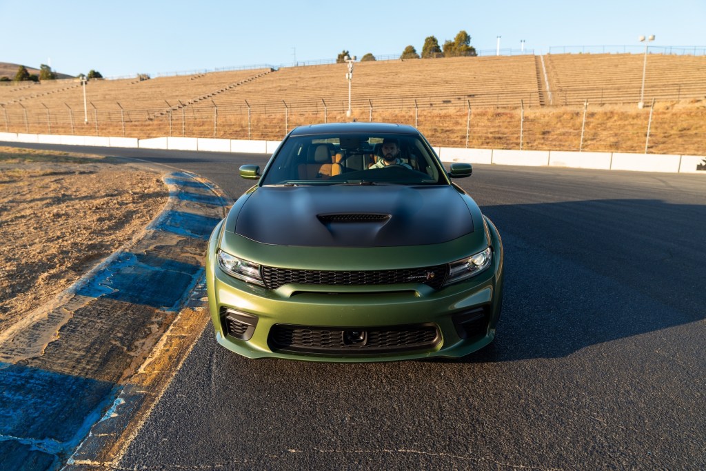 A green 2020 Dodge Charger sits on a racetrack