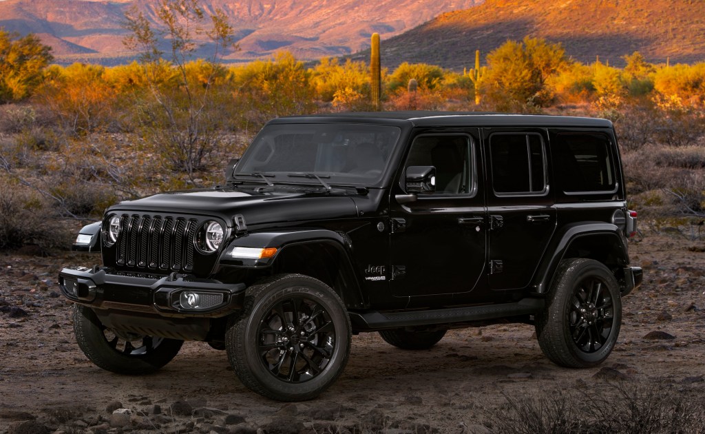 A black 2020 Jeep Wrangler SUV goes off-road.