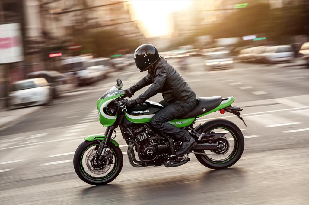 A rider on a green-and-white 2020 Kawasaki Z900RS Cafe