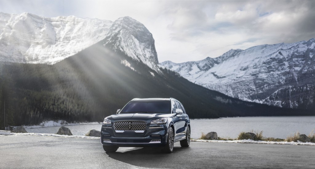 A 2020 Lincoln Aviator parked in front of a snowy mountain