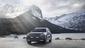 A 2020 Lincoln Aviator parked in front of a snowy mountain