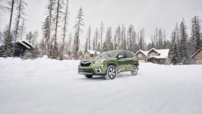 A 2020 Subaru Forester drives through the snow.