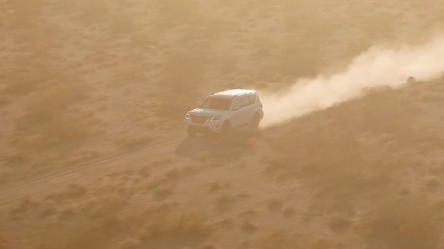 A teaser image of the 2021 Nissan Armada driving through the desert.
