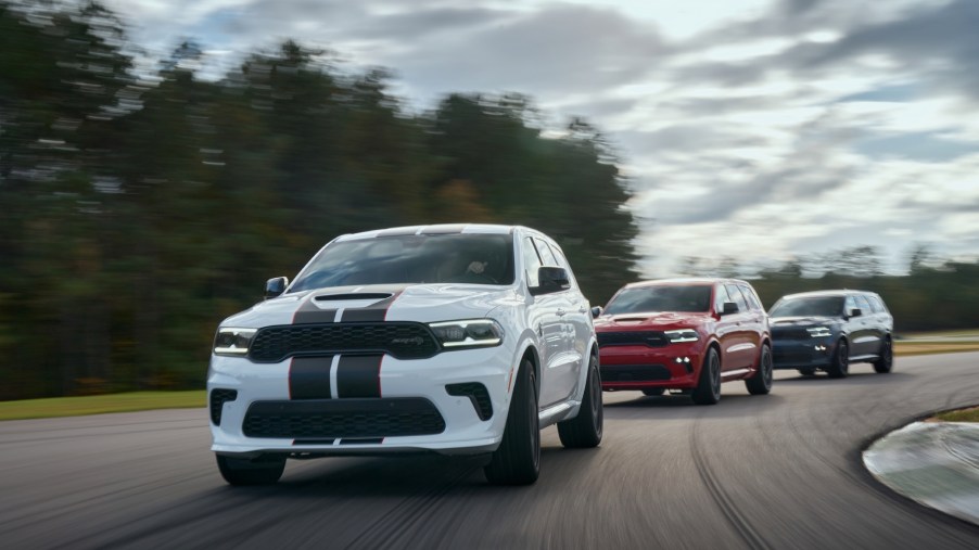 The 2021 Dodge Durango features new aggressive exterior styling, new interior with driver-centric cockpit, new R/T AWD Tow N Go (center) and 710-horsepower SRT Hellcat (left and right).