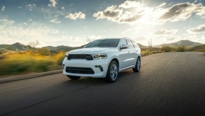 2021 Dodge Durango driving down a sunny road