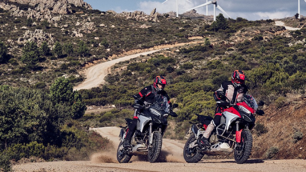 A silver and a red 2021 Ducati Multistrada V4 S on a desert trail