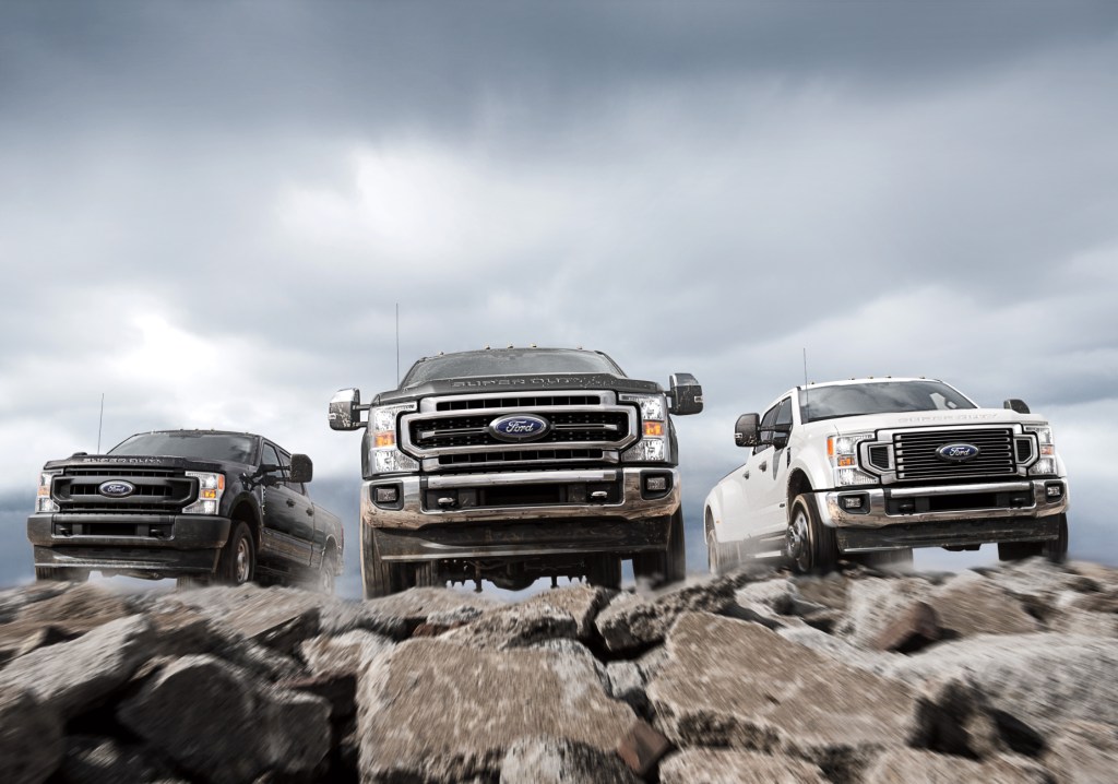 The 2021 Ford F-250, F-350, and F-450 posed on top of rocky terrain.