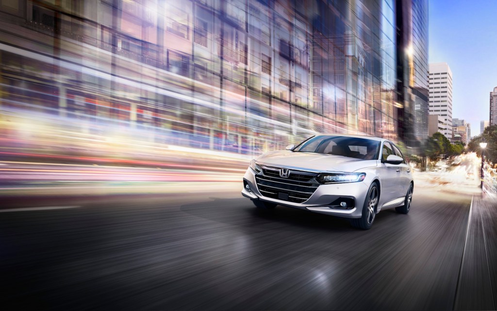 the 2021 Honda Accord Touring at speed in the city at night