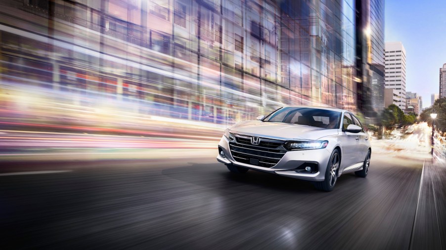 the 2021 Honda Accord Touring at speed in the city at night