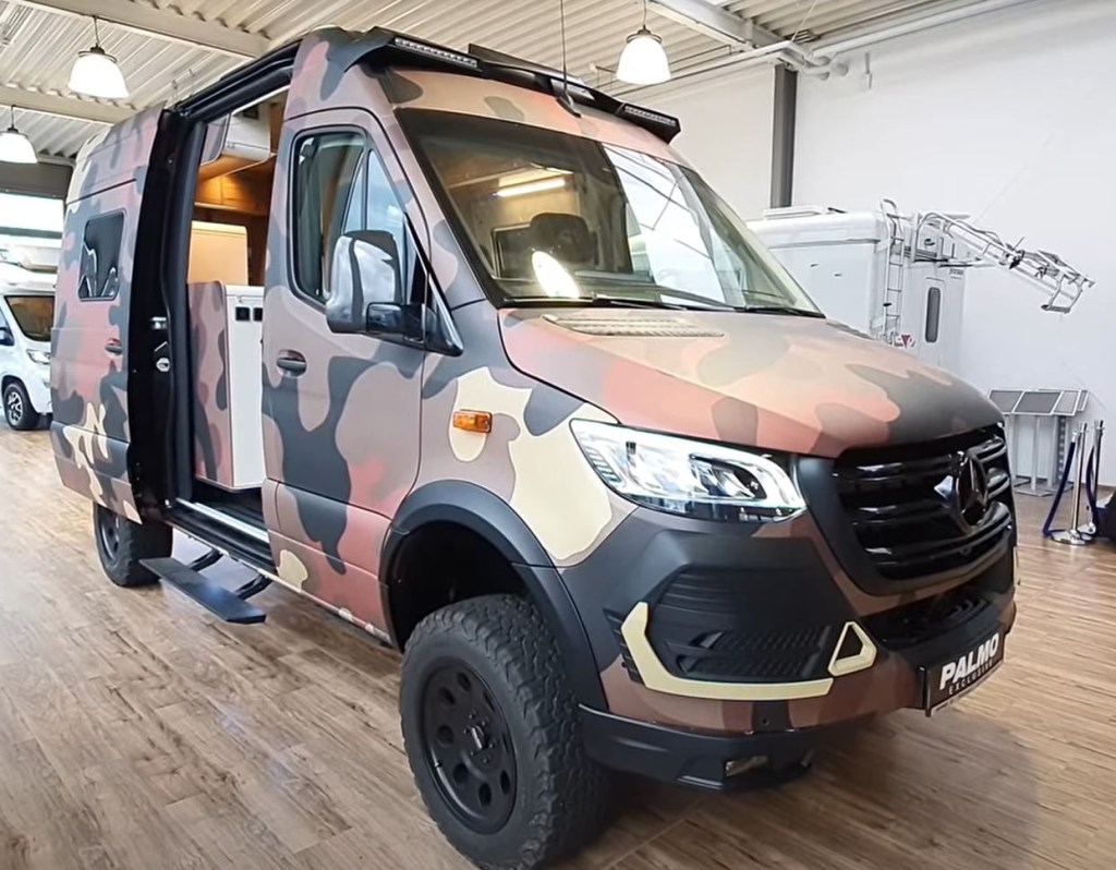 A camouflaged 2021 Hymer Grand Canyon RSX offroad RV