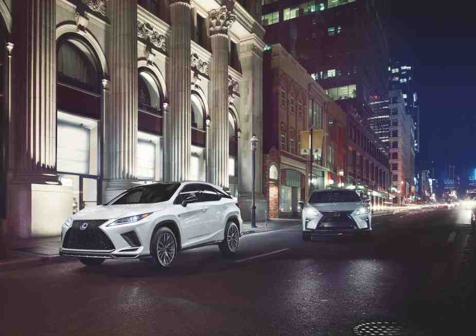 A white 2021 Lexus RX 450h on a city street