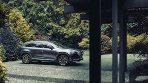 A silver 2021 Mazda CX-9 parked next to trees