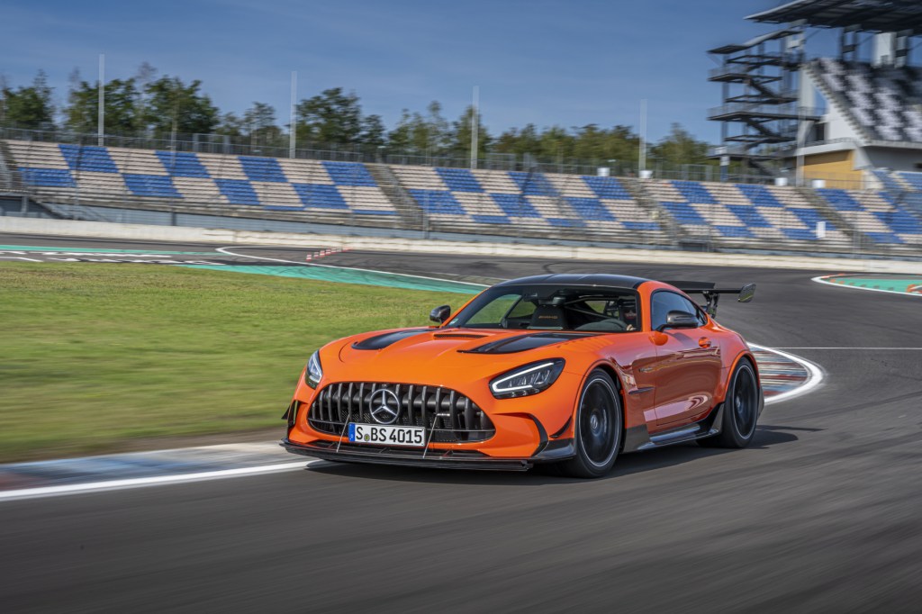 An orange 2021 Mercedes-AMG GT Black Series going around a corner on a race track