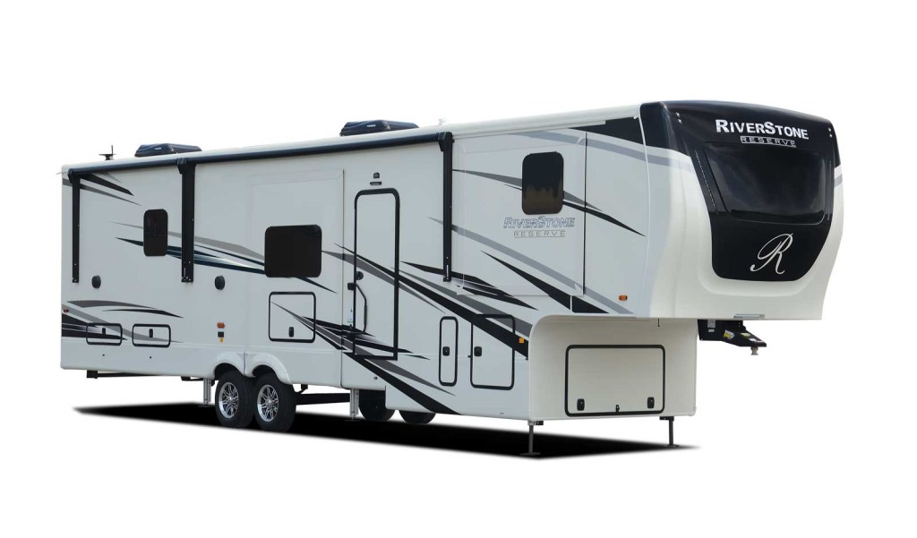 A luxury fifth-wheel RV by Forest River known as the Riverstone Reserve sits detached from the tow rig.