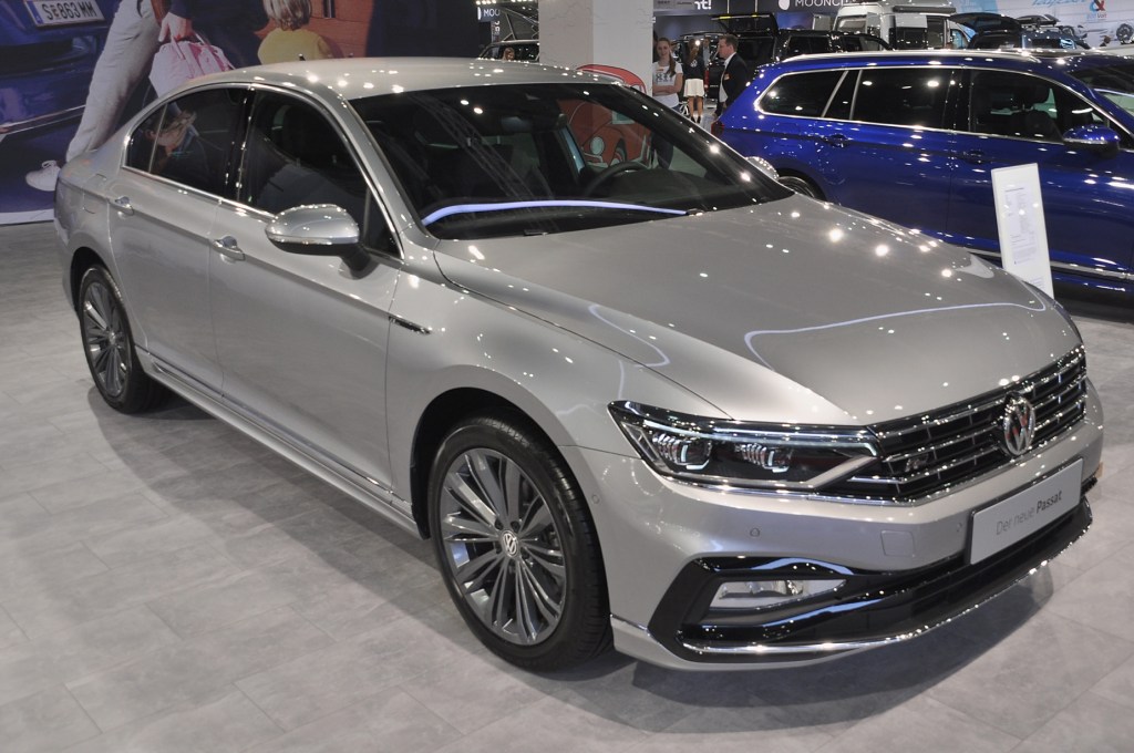A silver Volkswagen Passat on display at an autoshow