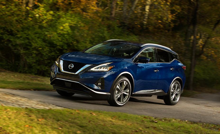 a blue 2021 murano driving on a scenic road