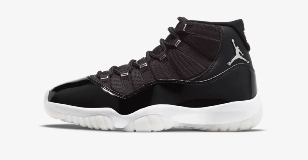 The side view of a black Air Jordan XI Jubilee