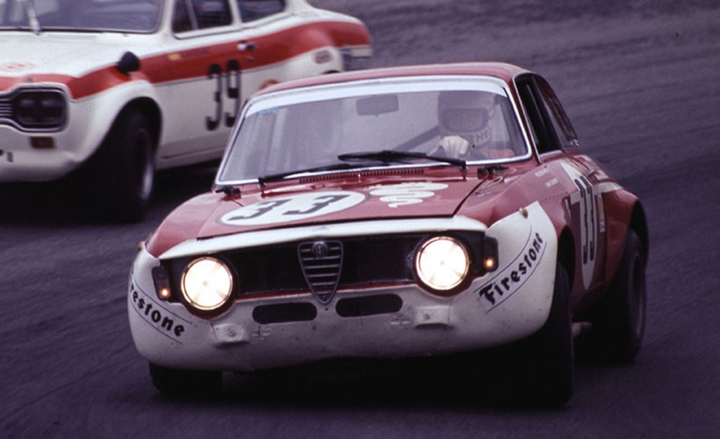 A white-and-red Alfa Romeo GTA 1300 Junior race car