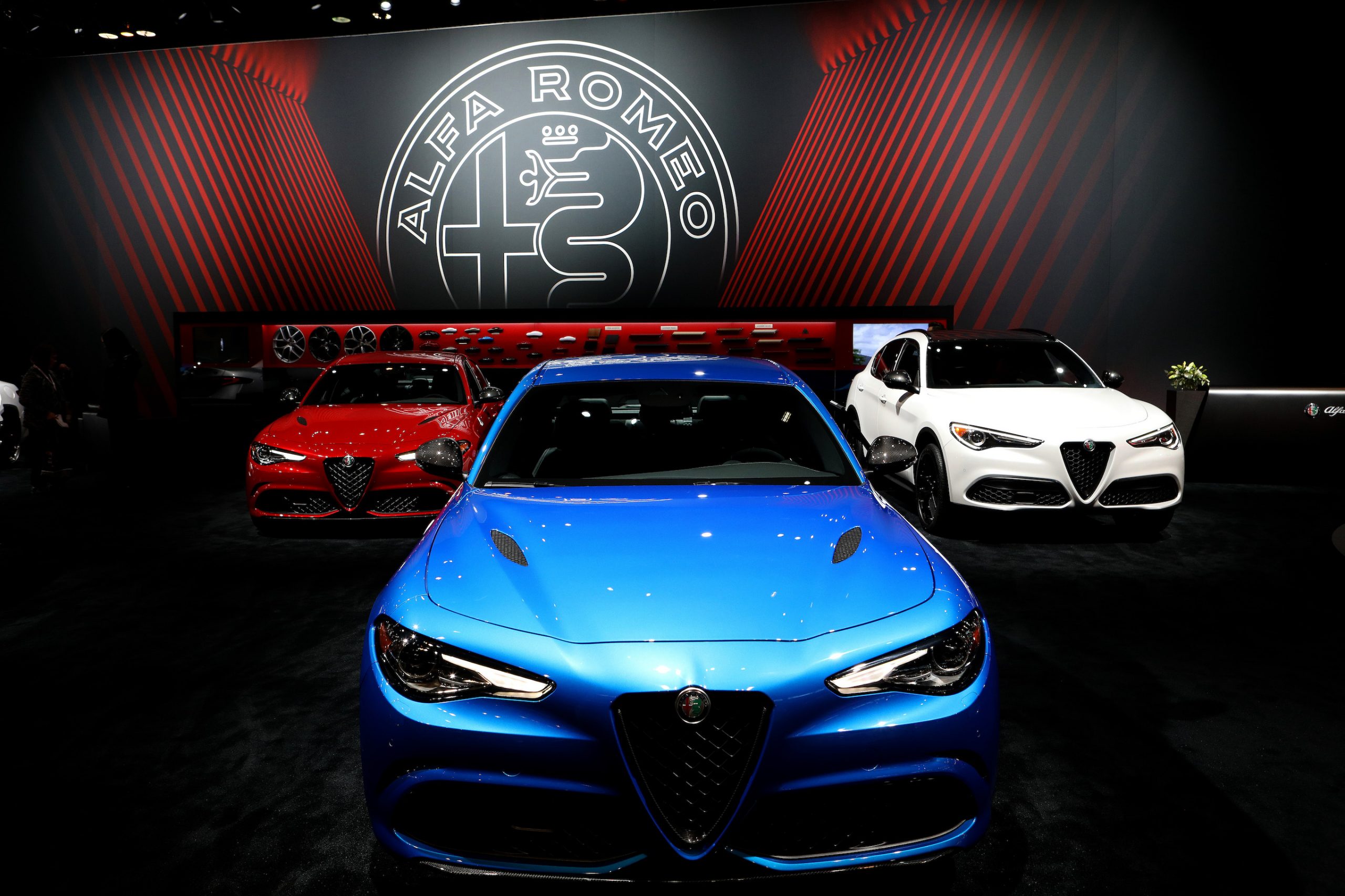 2019 Alfa Romeo Giulia (red and blue) and Alfa Romeo Stelvio are on display at the 111th Annual Chicago Auto Show