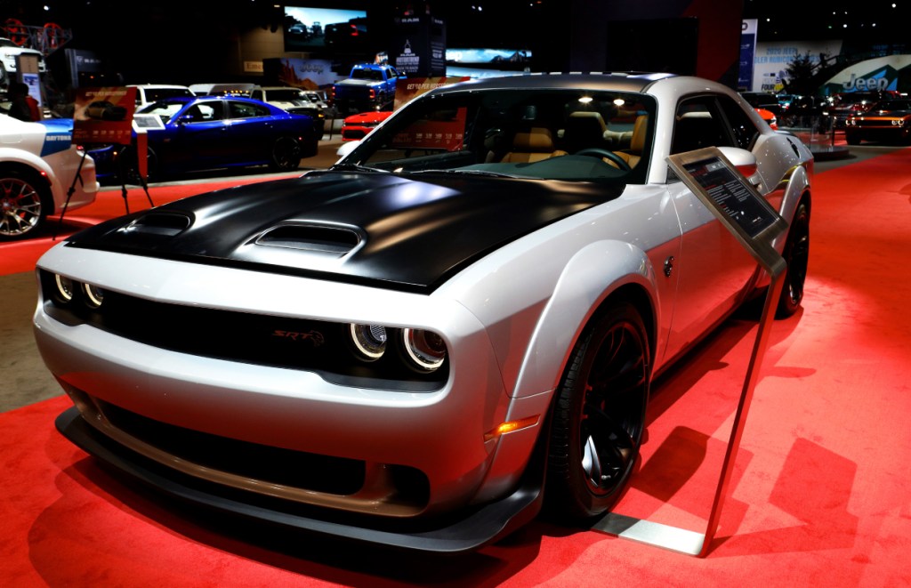 A Dodge Challenger on display at an auto show