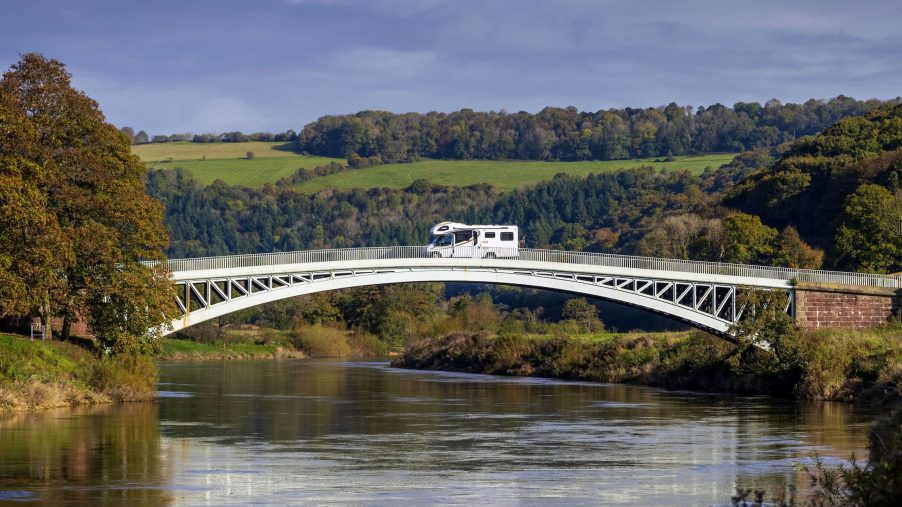 A camper van travels from the England to Wales over Bigsweir Bridge