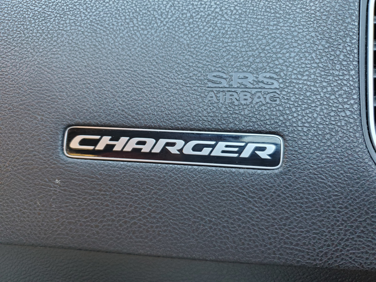 A close-up shot of a Dodge Charger steering wheel