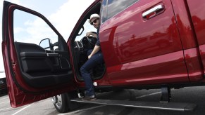 A man stepping out of his Ford F-450 pickup truck