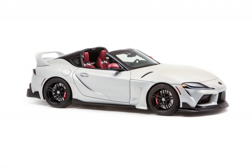 Passenger side view of a white Toyota Supra with the Sport Tops removed.