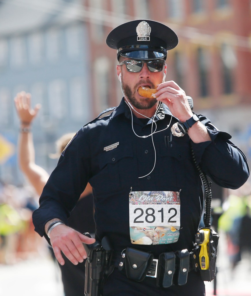 cop eating donut
