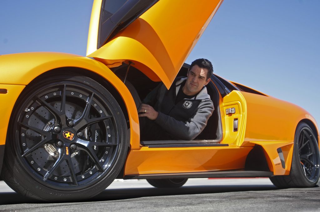 Black HRE aftermarket wheels on an orange Lamborghini