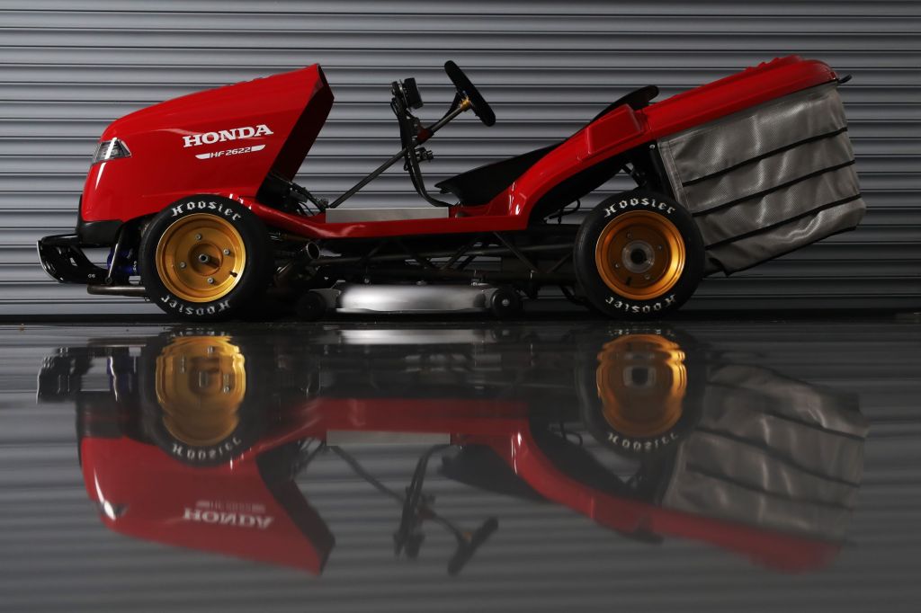 The side view of the red Honda Mean Mower V2