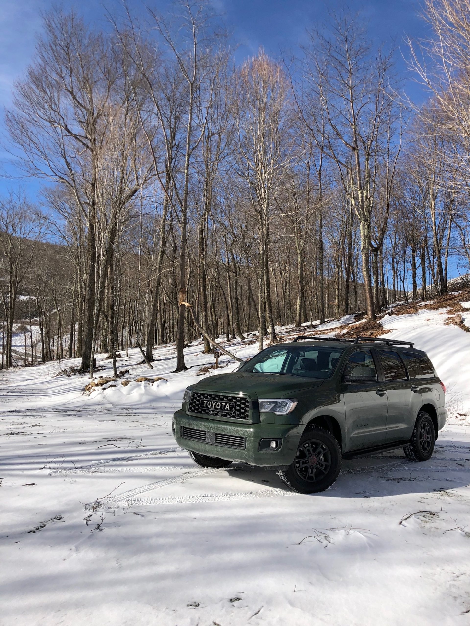 The army green 2020 Toyota Sequoia TRD Pro in the snow 