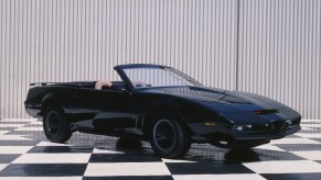 A black convertible Pontiac Firebird used as one of the original KITT cars from the 1980s TV series 'Knight Rider'