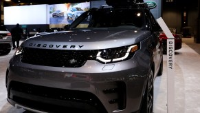 A Land Rover Discovery on display at an auto show