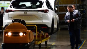 A Mazda CX-9 being assembled in a factory