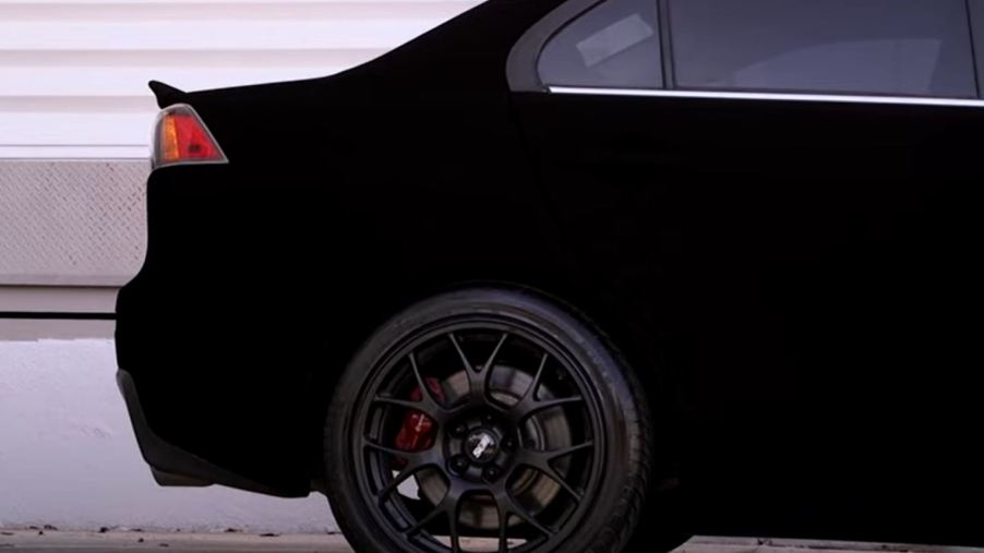 The rear of a Mitsubishi Evo painted in Musou Black